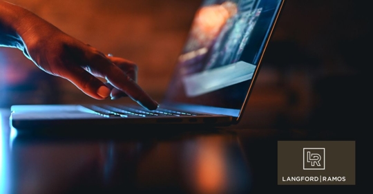 hand typing on computer keyboard